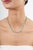 This tennis necklace features 13.8 carats of round-cut Sleeping Beauty turquoise, set in 18K yellow gold. Each turquoise...