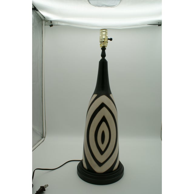 Add a touch of artisan elegance to your home with this stunning handcrafted lamp made from authentic Chulucanas pottery....