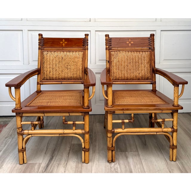 Here is a fabulous vintage three-piece seating set featuring a pair of bamboo and rattan lounge chairs with a matching...
