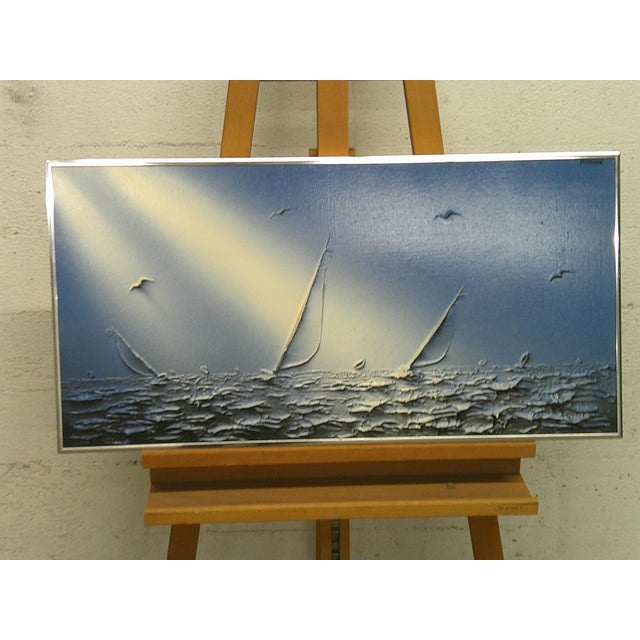 A striking modern seascape featuring sailboats gliding through shimmering waves beneath radiant beams of light. This piece...