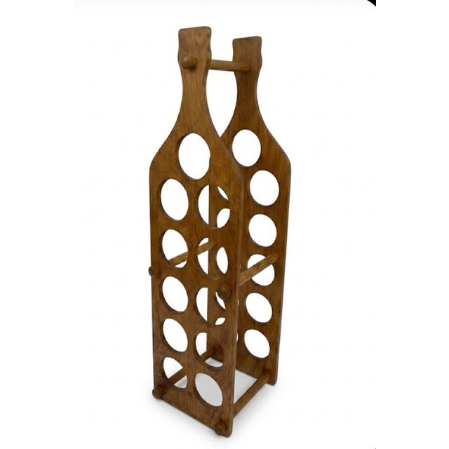 Make a bold statement in your home bar or dining lounge with this exceptional freestanding vintage wine rack. Melding...