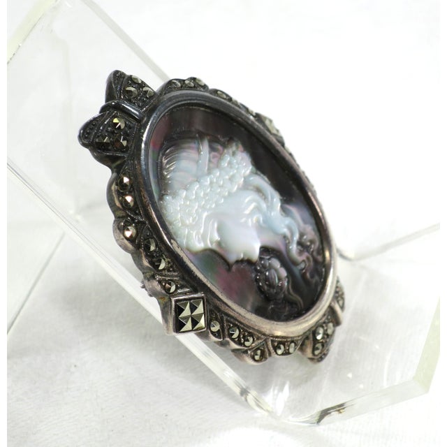 Antique Edwardian sterling and carved abalone cameo brooch with marcasites. Exquisitely carved cameo of a maiden with...