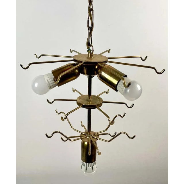 Superb Murano glass chandelier. The glass is cut by hand in the shape of leaves. The chandelier consists of a golden metal...