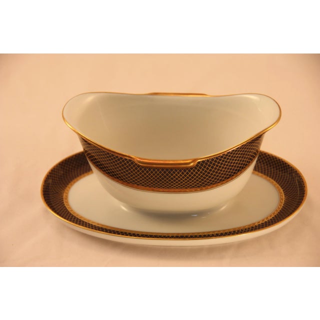This Sauce Boat with attached Plate is quite rare in blue and gold, there are more yellow and gold items available. I love...