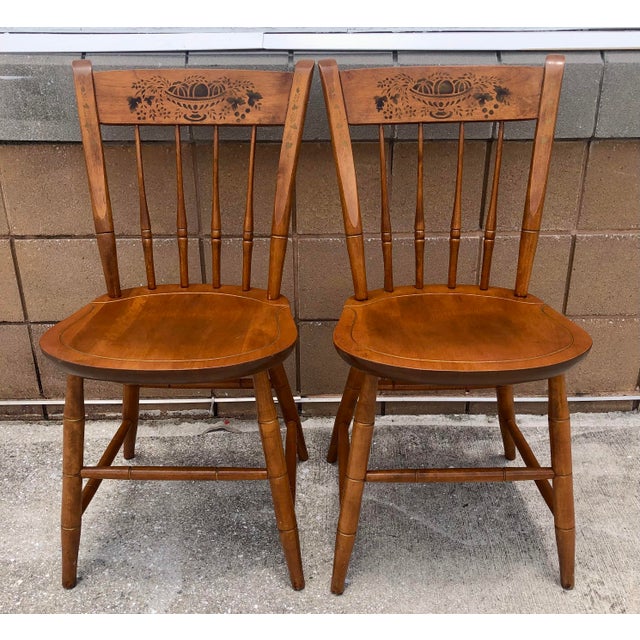 Beautiful pair of vintage Nichols and Stone solid maple wood side chairs. Beautiful stenciled design. Marked on bottom as...