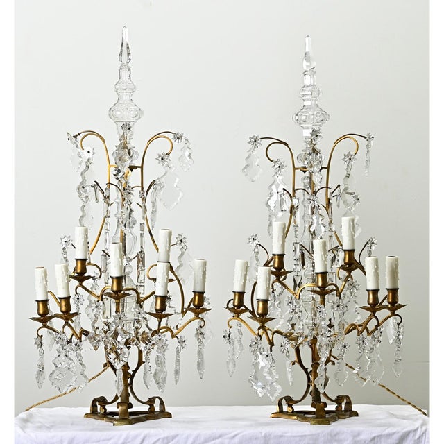 Dimensions: 37” H x 16 ¼” W x 12 ½” D A massive pair of French 19th century brass and crystal girandoles, also known as...