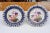 Pair of small Vieux Paris plates with tulips and roses decorating the center. Deep blue surround with gold details.