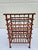 This antique stick and ball sheet music stand or magazine rack is full of charm. The upper five shelves slide forward for...