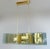 Italian modern chandelier with elongated light green glass panels mounted on polished brass frame with diamond shaped...