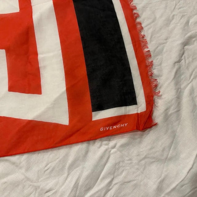 This oversized Givenchy scarf from the early 2000s is a bold, graphic statement piece crafted from lightweight and...