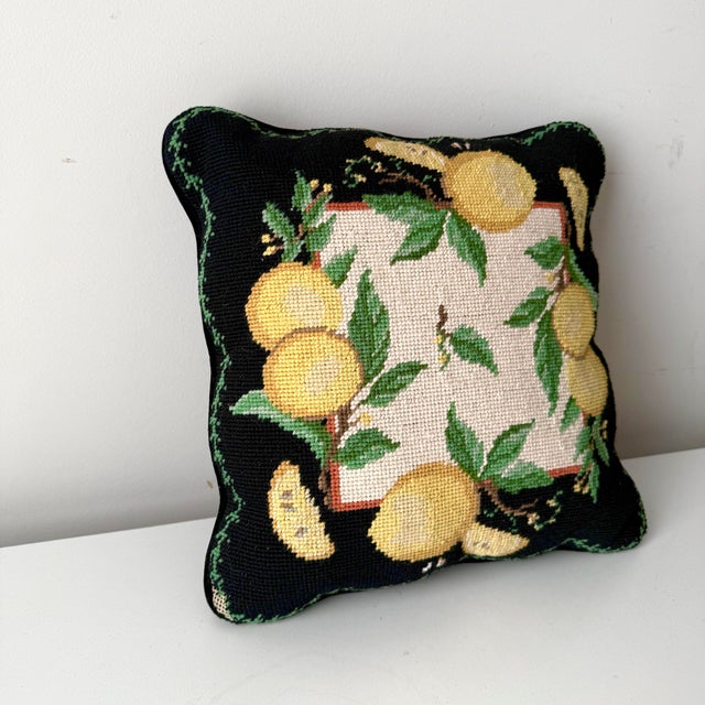 Vintage scalloped lemon wool needlepoint throw pillow. The pillow's design features whole and lemon slices with small...