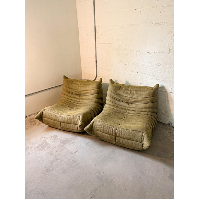 An iconic pair of Togo lounge chairs designed by Michel Ducaroy for Ligne Roset. Originally introduced in 1973, the Togo's...