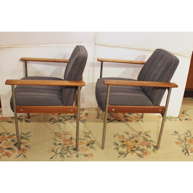 1960s-70s pair of teak & steel arm chairs, Dokka Mobler, Norway. Designed by Sven Ivar Dysthe for Dokka Mobler about 1959,...