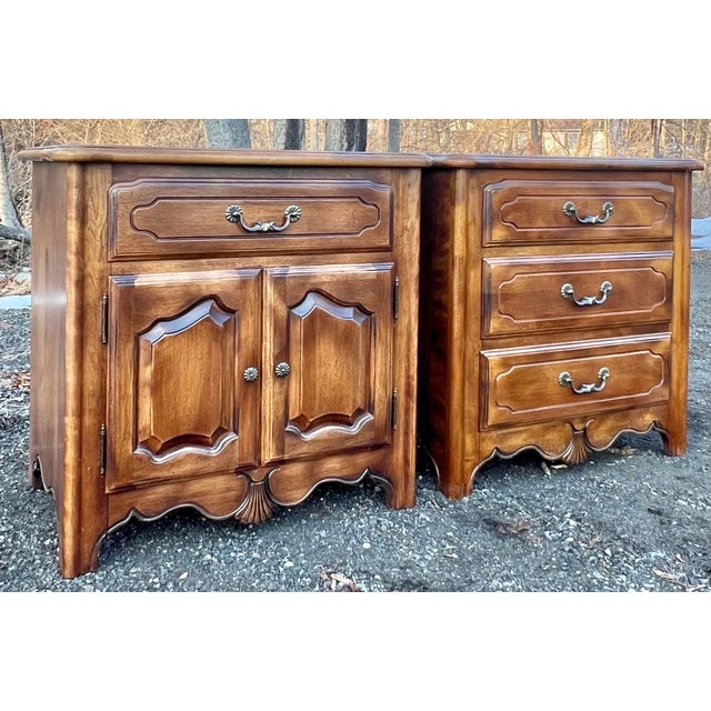 Coordinated pair for f nightstands by Ethan Allen from their Country French Collection. Crafted in solid maple and birch...