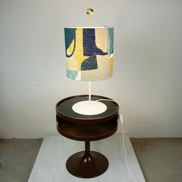 This rare and charming austrian mid century table lamp features a white lacquered metal tulip base and beautiful brass...