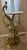 Side table with golden peacock base and round marble top. Maker unknown. Great condition. 30” height to crown of peacock....