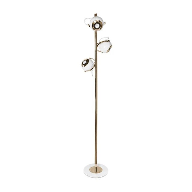 Scofield is an unusual floor lamp with five chrome lights all supported by a white brass base. Each light and bracket...