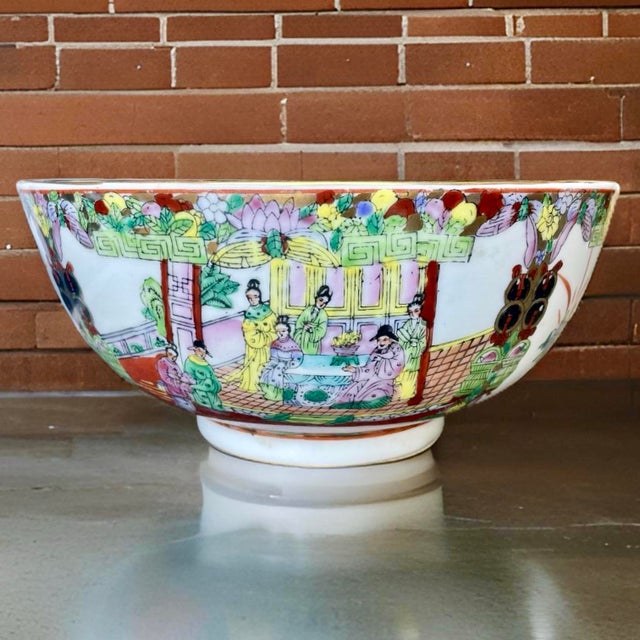 A stylish vintage Chinese Famille Rose decorative ceramic bowl, hand-crafted in the mid 20th century, circa 1940s. The...