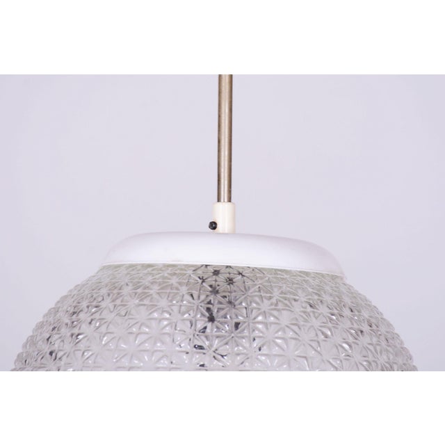 This stylish and highly elegant chandelier, originating from the 1960s from Czechoslovak production, represents an...