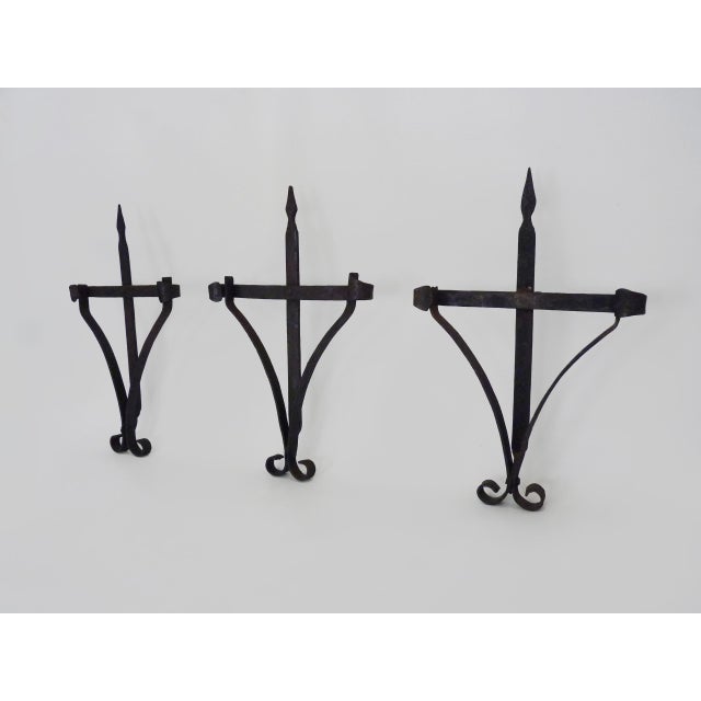 3 large wrought iron wall candle holders. 19th century outdoor candle holders Superb trio of wrought iron wall...