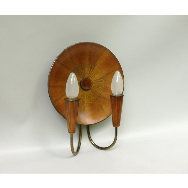 A rare “Sunburst” wall light manufactured by Temde in the 1950s. The lamp is of high quality and crafted with great...