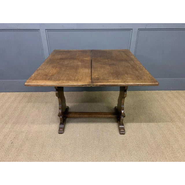 A charming Ipswich oak side table with a fold over top. Very well constructed in solid English oak, with a good colour and...