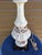 Phil Mar vintage lamp with shade features ornate rose floral detailing. It has a brass and ceramic base. Minor...