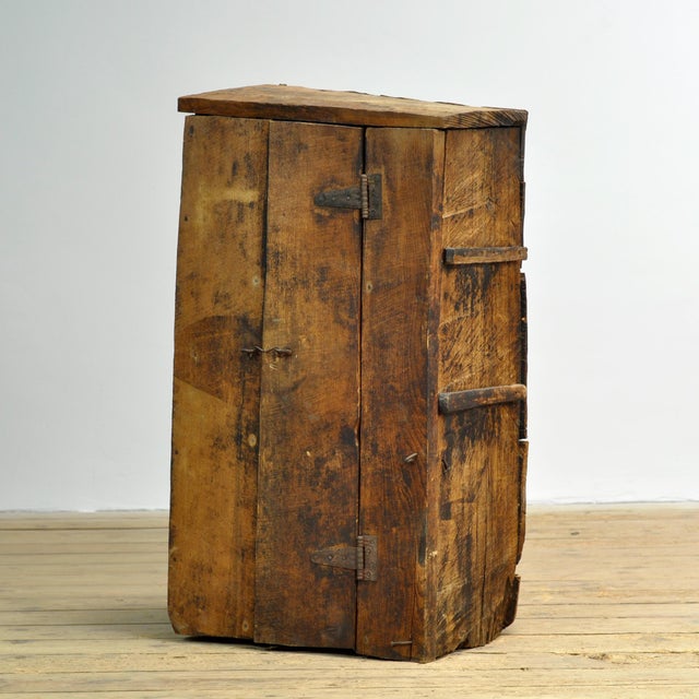 Authentic wooden cabinet, presumably made around 1930 from solid hardwood. The cabinet is constructed in a primitive...