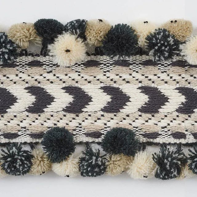 Inspired by traditional Peruvian textiles, Maracana Pom is a dimensional woven trim with playful, multi-colored pom-poms....