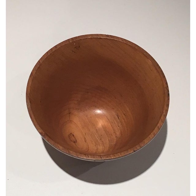 This small bowl is made of wood. It is stamped in the paste. Circa 1970