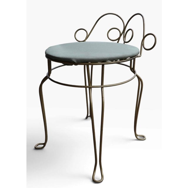 Mid Century wire framed vanity stool with upholstered pad seat. The stool is in good vintage condition, the seat has been...
