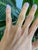 Eight round earth-mined diamonds sparkle across this solid 14K yellow gold band, totalling 0.09 carats. A clean, classic...