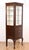 Vintage mahogany medical display cabinet in dark wood tones with glass shelves. Built tall and narrow to fit into tight...