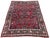 A fabulous antique Sarouk rugt, woven circa 1920. The rug features an allover design of flower bouquets on a terracotta...