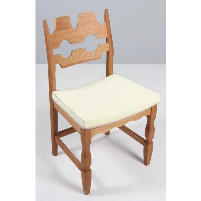 A striking dining chair by Henning Kjærnulf, made of oak and ready for you to upholster Refreshing design with bold...