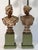 A stylized pair of hand-carved cerused oak neoclassical bust lamps on plinth bases.