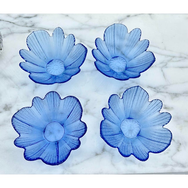 Vibrant blue pressed glass bowls in a flower petal design. A perfect set of 4. These bowls are so beautiful to look at...