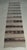 Vintage Navajo-style handwoven wool runner featuring a warm neutral palette of ivory, tan, brown, and deep charcoal. The...