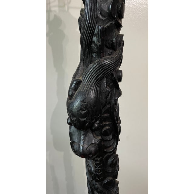 Early 20th century Chinese export floor lamp, heavily carved and with exceptional details. Most likely of Chinese...