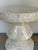 Stylish Mother of Pearl Round Accent Table, geometric mosaic pattern, hourglass inspired silhouette. Showroom floor sample.