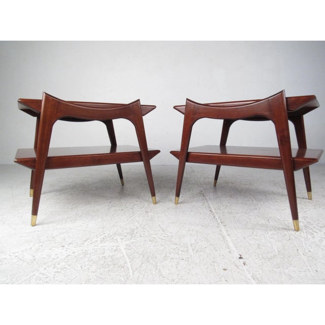 Gorgeous Italian style two-tier end tables with sculpted sides and capped feet. Made with rich rosewood grain and tapered...