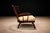 A sculptural Brazilian modern armchair by A Forma Decorativa, executed in richly toned solid imbuia hardwood, one of...