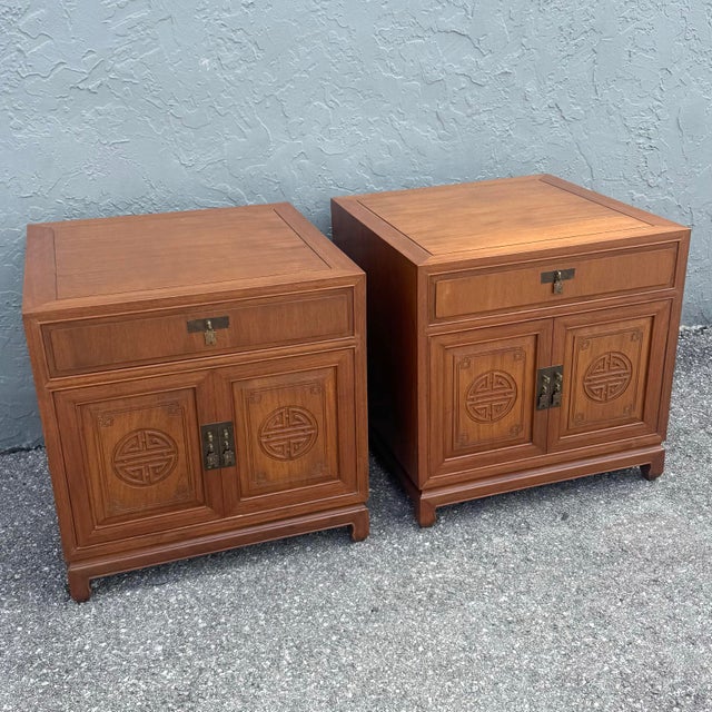 A refined pair of Taiwanese Ming-style walnut nightstands by Ricardo Lynn, beautifully showcasing clean architectural...