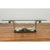A contemporary silver on bronze coffee table scrolling base called 'The Wave'. The glass top shown in the photos is not...