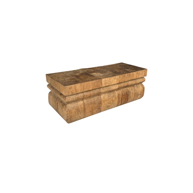 A striking balance of sculpture and function, this reclaimed teak wood table is defined by its bold architectural...