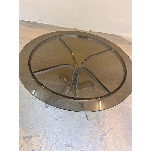 This round dining table from the 1970s is a striking sculptural centerpiece for any dining area. The design captures the...