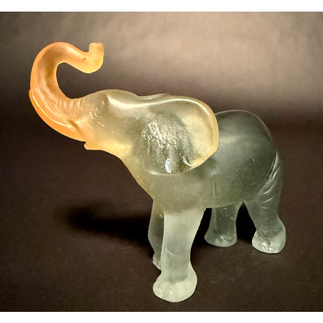 Elegant mid-century elephant sculpture by Daum, expertly crafted in pâte de verre—a glass paste casting technique...