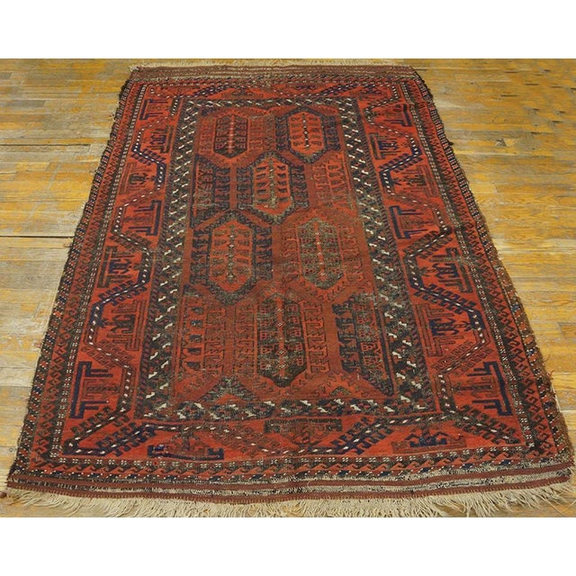 Antique Baluch Rug 4' 6" x 6' 8" - 4'6" x 6'8" Antique Baluch Persian Coral 1900s Rug, Circa Date: 1900s. This exceptional...