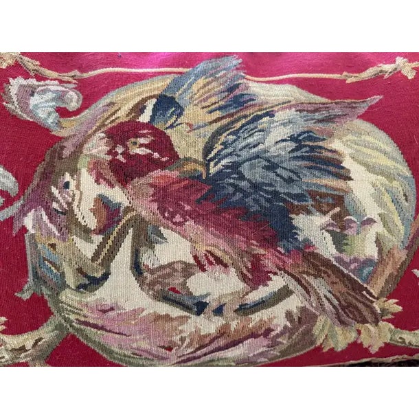 This elegant vintage Aubusson-style pillow features a richly detailed wool tapestry depicting a vibrant parrot set against...