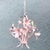 A charming vintage Italian chandelier crafted in painted tole metal, blooming with sculpted floral forms in a soft blush...